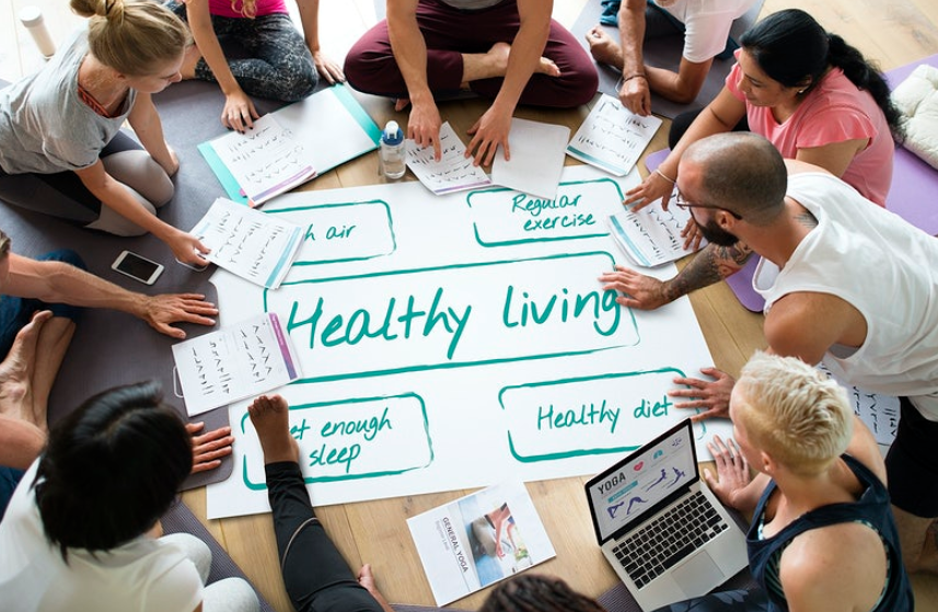group of people gathered around healthy living at the center
